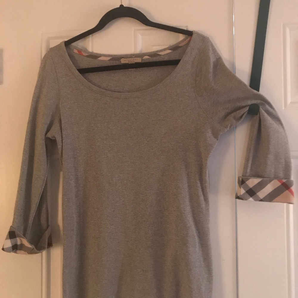 Burberry 3/4 sleeve T-shirt with plaid cuffs.